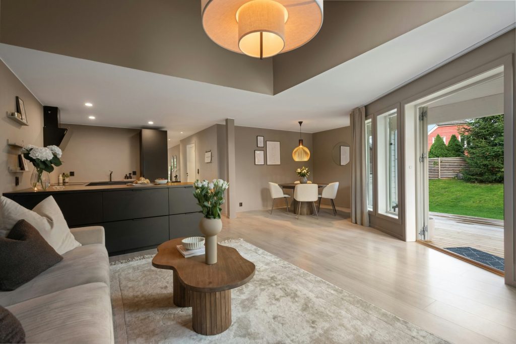 A living room filled with furniture and a large window